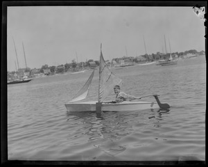 Boy in home made sail boat