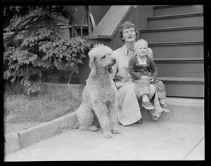 Woman, child and poodle