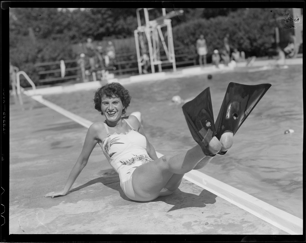 Women at poolside with flippers