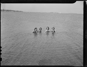 Four women taking a dip