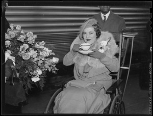 Woman in wheelchair receives flowers