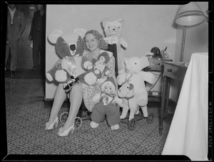 Woman with stuffed animals