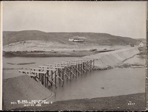 Wachusett Reservoir, pile trestle and embankment of soil stripping railroad, Section 6, from the south. Cunningham's pavilion in background, Boylston, Mass., May 23, 1899