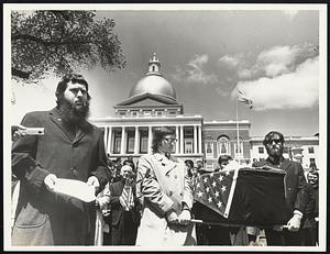 Charles Fager speaking, is with Clergy March along freedom train