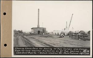 Contract No. 85, Manufacture and Delivery of Precast Concrete Steel Cylinder Pipe, Southborough, Framingham, Wayland, Natick, Weston, showing steam plant for heating 60 in. pipe sections, also canvas caps for cold weather protection on 60 in. pipe sections, Lock Joint Pipe Co., Natick, Mass., Oct. 27, 1939