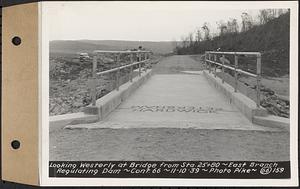 Contract No. 66, Regulating Dams, Middle Branch (New Salem), and East Branch of the Swift River, Hardwick and Petersham (formerly Dana), looking westerly at bridge from Sta. 25+80, east branch regulating dam, Hardwick, Mass., Nov. 10, 1939