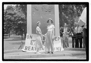 Two girls shaking hands in front of Declaration of Independence Tablet, Boston Common