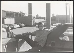 Jimmy Driscoll leaning on a car