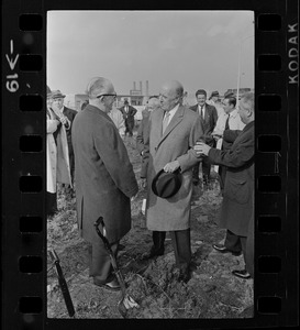 Sears president, Crowdus Baker, speaking with an unidentified man, most likely Harold G. Kern, publisher of the Record American-Sunday Advertiser, at the groundbreaking for the new Sears Distributing Center
