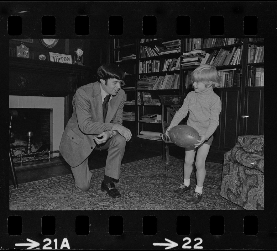 Patriots General manager, Upton Bell, at home playing with his son Christopher