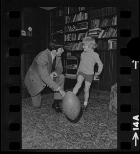 Patriots General manager, Upton Bell, at home playing with his son Christopher