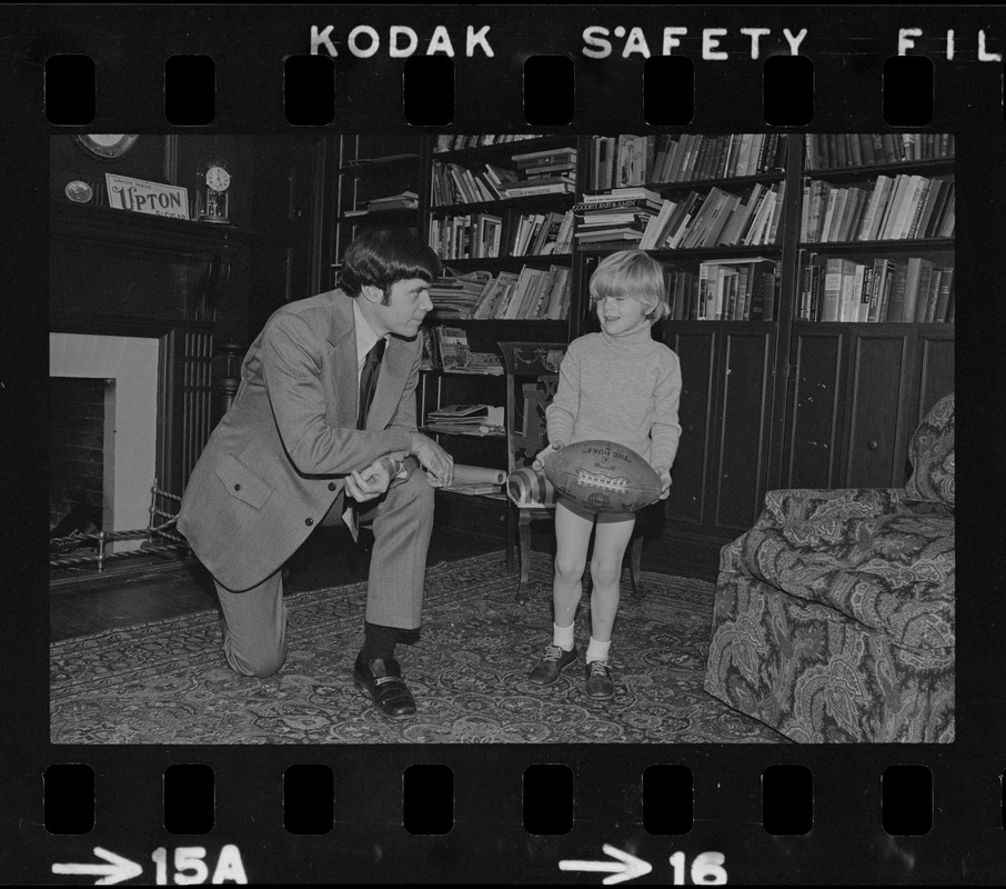 Patriots General manager, Upton Bell, at home playing with his son Christopher