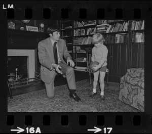 Patriots General manager, Upton Bell, at home playing with his son Christopher