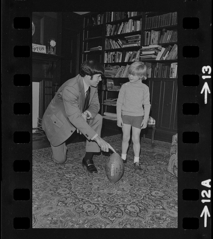 Patriots General manager, Upton Bell, at home playing with his son Christopher