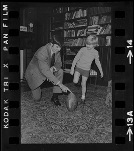 Patriots General manager, Upton Bell, at home playing with his son Christopher