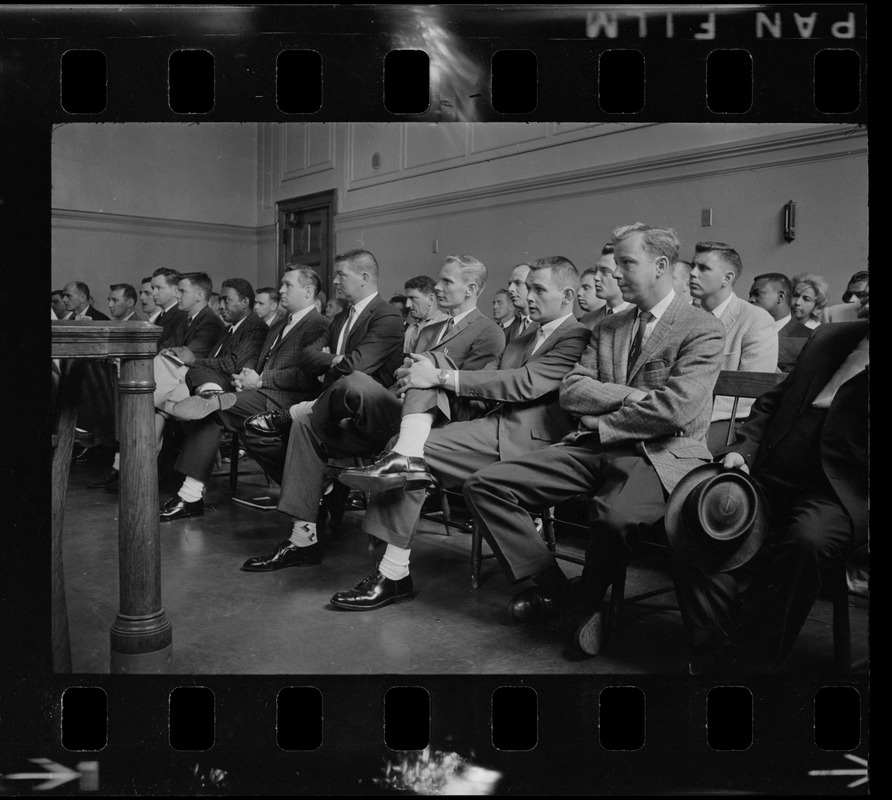 A group of men, most likely new police officers, sitting in a Boston Municipal Courtroom while Judge Adlow presides over a session