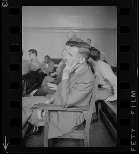 A man, most likely a new police officer, seen in Boston Municipal courtroom audience while Judge Adlow presides over a session