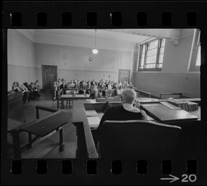 Judge Adlow seen from behind presiding over a session in Boston Municipal Courtroom