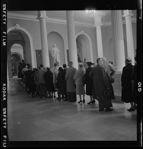 Mourners lining up through Doric Hall in the State House to pay respects to James M. Curley