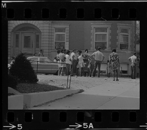 Crowd of people gathered in front of building, most likely on Washington Street, near Jeremiah E. Burke High School in Dorchester at time of student demonstrations