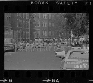 Boston police cadets lined up on Washington Street near Jeremiah E. Burke High School after unrest broke out during student demonstrations
