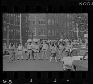 Boston police cadets lined up on Washington Street near Jeremiah E. Burke High School after unrest broke out during student demonstrations