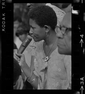 Unidentified woman, most likely a Black community leader or activist, speaking during Black student rally in Franklin Park