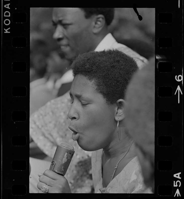 Unidentified woman, most likely a Black community leader or activist, speaking during Black student rally in Franklin Park