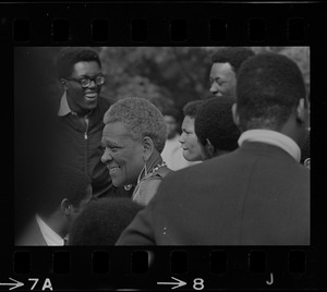Unidentified woman, seen in the crowd of attendees during the Black student rally in Franklin Park