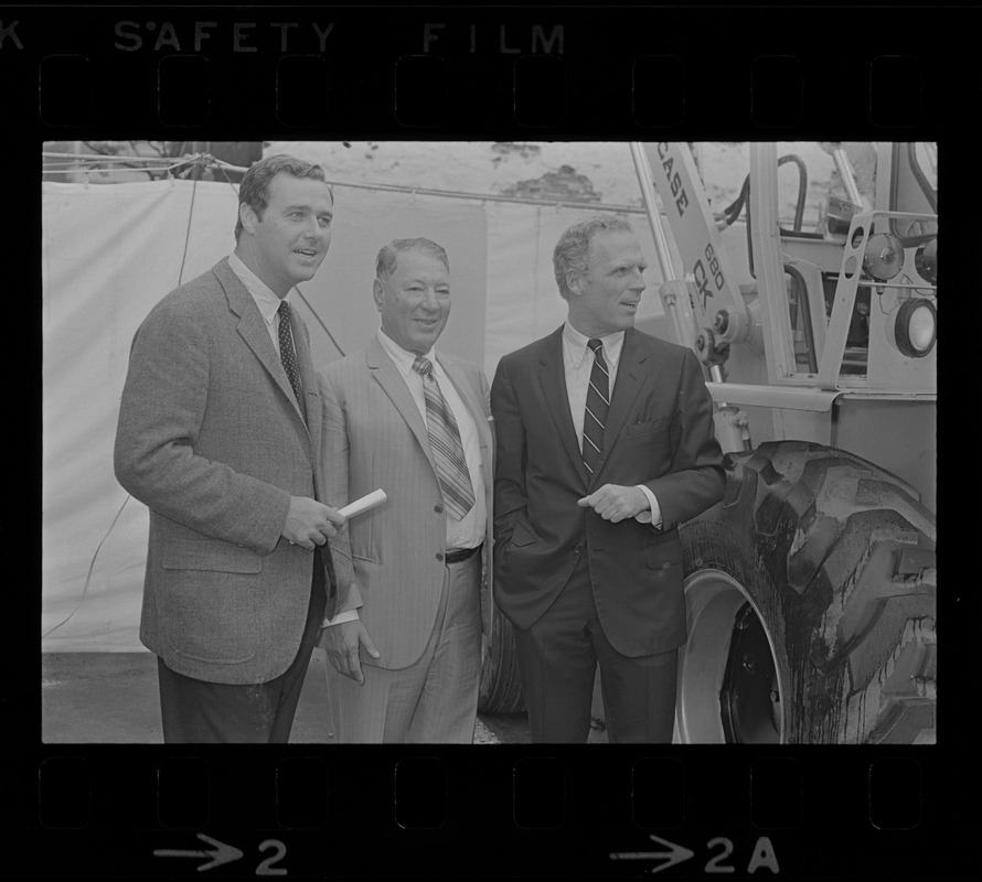 An unidentified man, John Philopoulos and Mayor Kevin White at the groundbreaking ceremony for the new "57 Building" on the corner of Stuart and Carver Streets