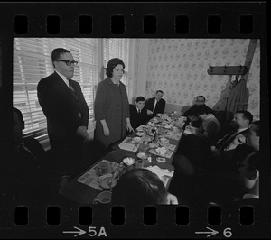 Louise Day Hicks speaking to a group of men at a restaurant, most likely campaigning for mayor or city council