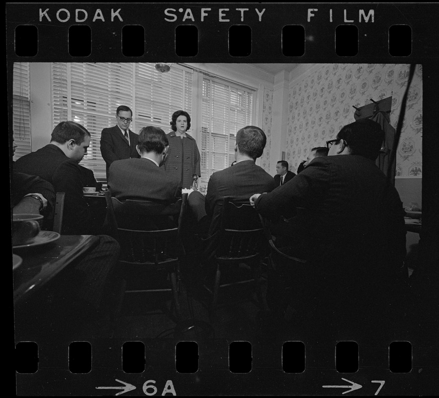 Louise Day Hicks speaking to a group of men at a restaurant, most likely campaigning for mayor or city council