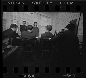 Louise Day Hicks speaking to a group of men at a restaurant, most likely campaigning for mayor or city council