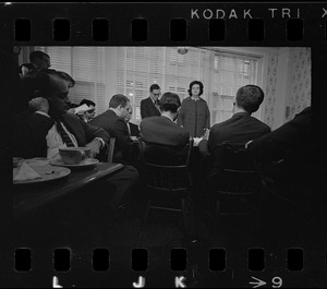 Louise Day Hicks speaking to a group of men at a restaurant, most likely campaigning for mayor or city council