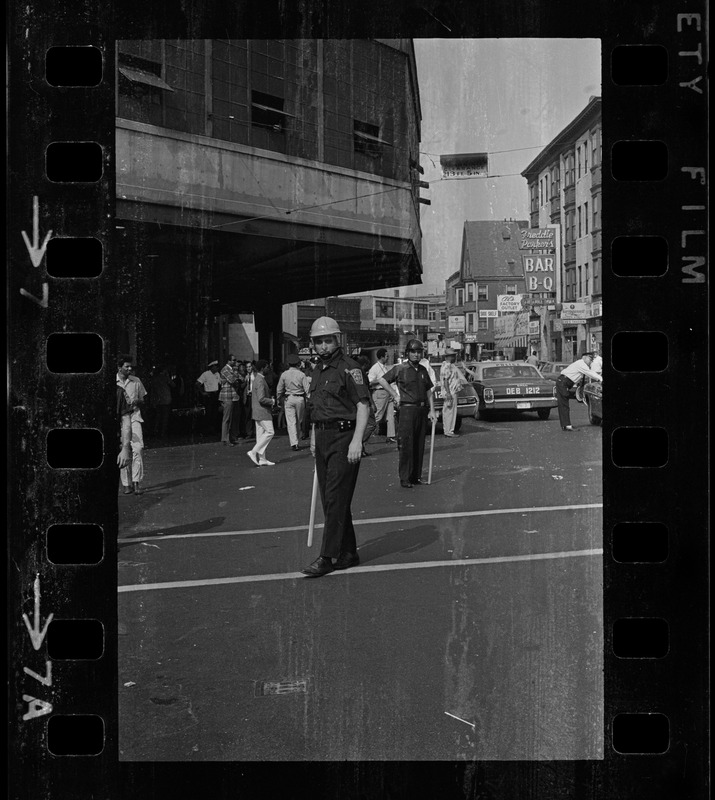 Riot police on the streets near the Dudley St. MBTA station after unrest broke out during student demonstrations at nearby schools