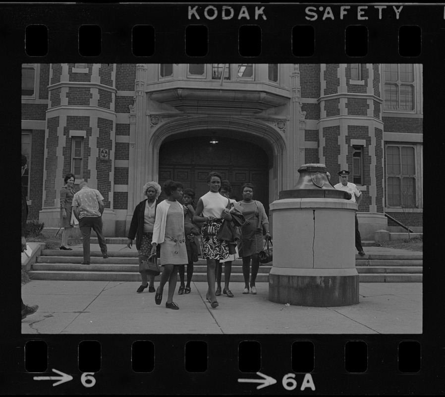 Black women exiting East Boston High School during the time of student demonstrations