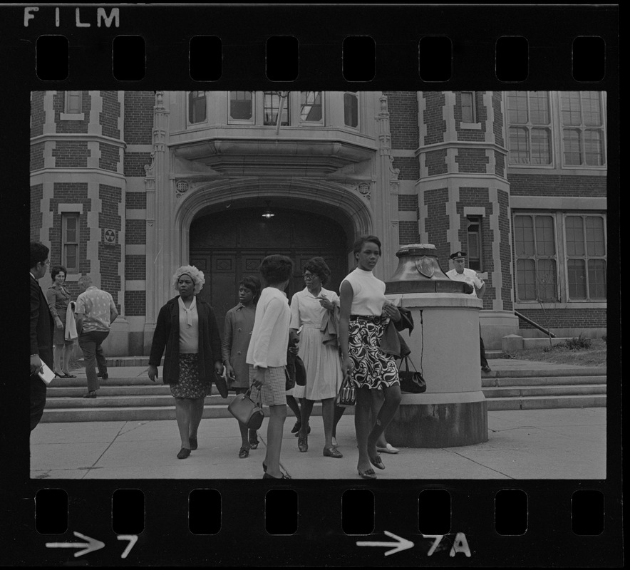 Black women exiting East Boston High School during the time of student demonstrations