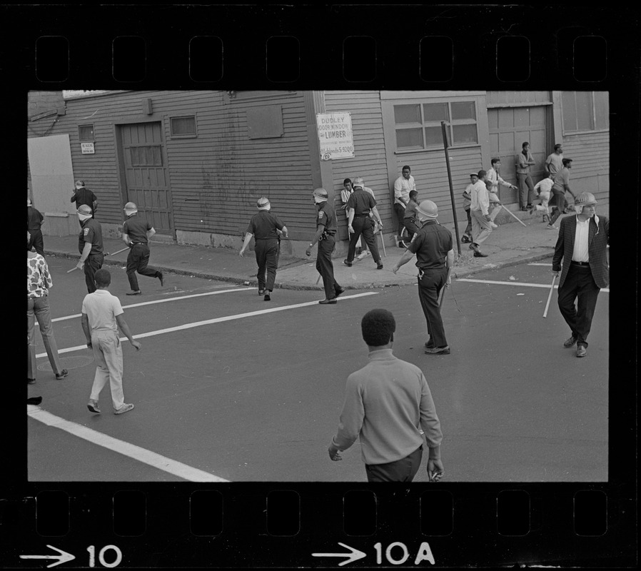 Riot police seen in the middle of a Roxbury street after unrest broke out during student demonstrations at nearby high schools