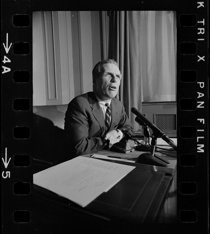 Mayor White seated at his desk during his weekly press conference