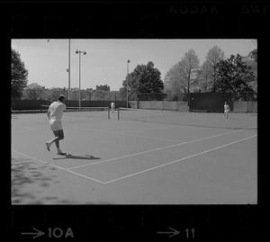State Treasurer Robert Q. Crane playing tennis against Mayor Kevin White, most likely at the Boston Common tennis courts