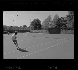 State Treasurer Robert Q. Crane playing tennis against Mayor Kevin White, most likely at the Boston Common tennis courts