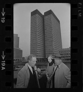 Mayor-elect of Boston Kevin White, left, Robert Morgan, Government Center Commission chairman, right, and an unidentified man seen while White tours the new City Hall