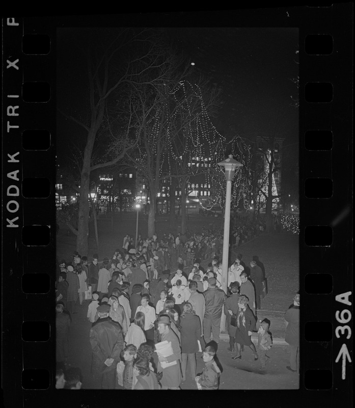 Thousands of shoppers began converging on picturesque Boston Common last night shortly after some 60,000 Christmas lights were illuminated by Mayor White, officially marking the opening of the 21st annual Christmas Festival