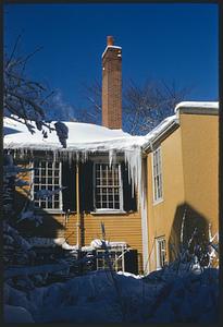 Icicles on yellow building