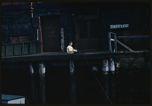 Child sitting on Long Wharf, Boston