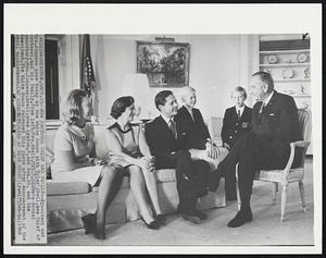 New Protocol Chief and Family--President and Mrs. Johnson pose today at the White House with Tyler Abell, new Chief of Protocol, and his family. From left: Mrs. Abell, Mrs. Johnson's social secretary; Mrs. Johnson; Abell; sons Lyndon, 8, and Dan, 10, and the President. The White House released this photo after announcement of the Abell appointment.