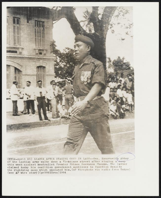 Leader After Staging Coup in Laos -- Gen. Kouprasith Abhay of the Laotian army walks down a Vientiane street after staging a coup this week against neutralist Premier Prince Souvanna Phouma. The latter claimed today his coalition government continues to function despite the rightwing coup which unseated him.