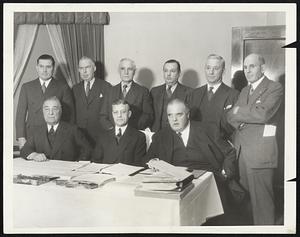 American League Club Owners at Meeting. This group of club owners, of the American League was photographed in Chicago December 12 at the winter baseball meeting. Seated, left to right: col. Jacob Ruppert of the Yankees; William Harridge, president of the League; J. Louis Comiskey, White Sox. Standing: Thomas a. Yanwkey, Boston; Frank Navin, Detroit; Clark Griffith, Washington; L.A. Von Weis, St. Louis; Alva Bradley, Cleveland; John D. Shibe, Philadelphia.