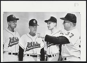 Camp Talk-Manager Ed Lopat, right, of Kansas City A’s, talks with hopefuls at Daytona Beach, Fla., advance training camp, pitchers Norman Bass and Lew Krausse and letfielder John Wojcik.