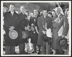 Leave for London to Plead Boston’s Cause. Members of a Massachusetts Delegation leaving by plane for London to try and obtain the United Nations Organization site for Boston Cause before boarding their plane at Bedford Airport today. (Nov. 24). Left to right they are: Gov. Maurice J. Tobin of Massachusetts; Orvel Adams, Vice President of First National Bank of Boston; Erwin D. Canhan, editor of the Christian Science Monitor; George H. Perkins, Harvard University and Karl T. Compton, President of Massachusetts Institute of Technology.